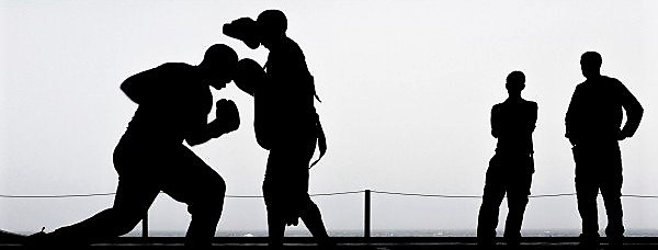 silhouettes-of-men-training-box-outdoors